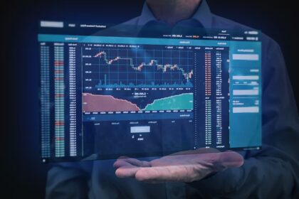 Stock market index board showing mixed performance with a Federal Reserve press briefing in the background and a calendar marked for June rate cut speculation.